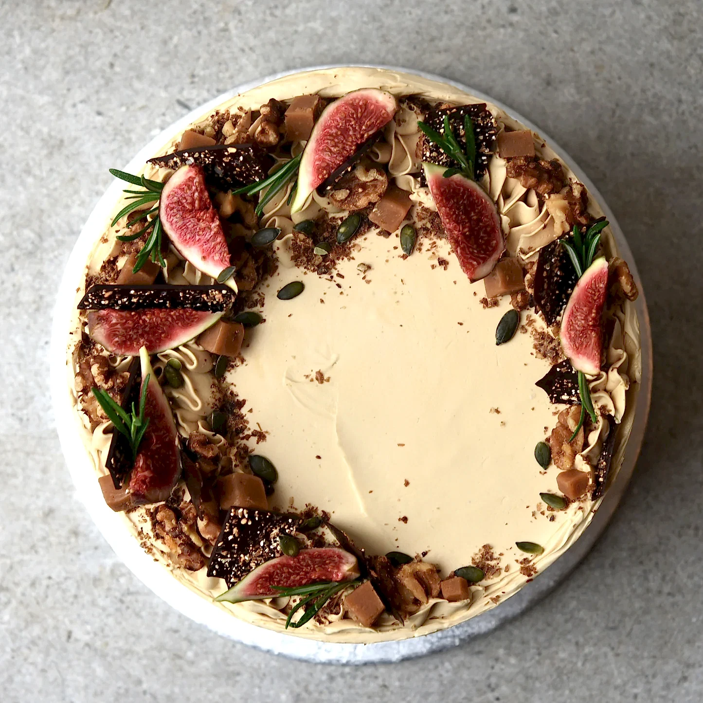 A seasonal cake flavoured with sticky toffee and pecan naturally decorated